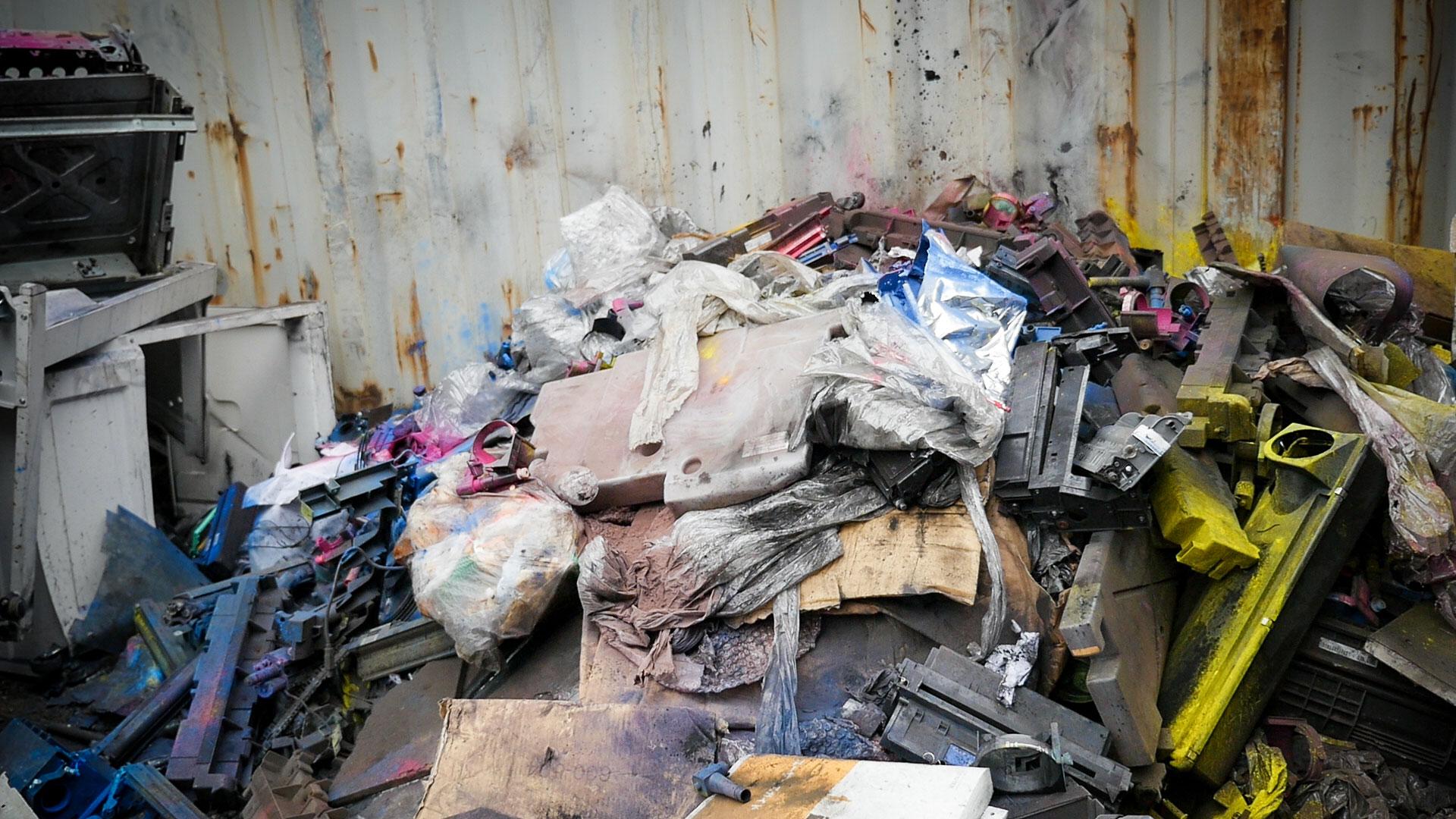 A pile of printer parts dusted with toners like carbon black, a probable carcinogen known to cause respiratory problems.