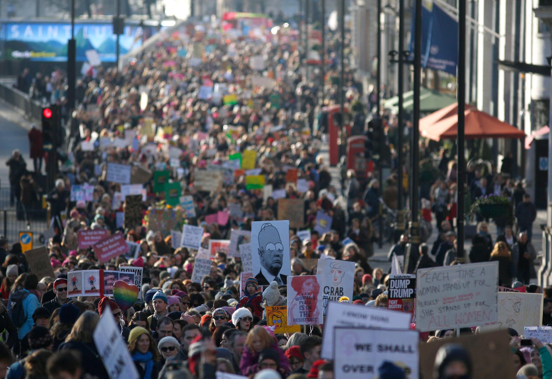 Protesters take part in the Women's March on London, as they walk from the American Embassy to Trafalgar Square, in central London