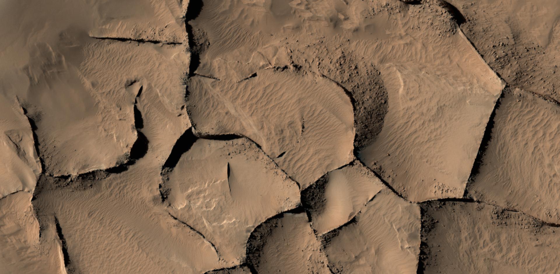 This view shows part of an area on Mars with narrow rock ridges, some as tall as a 16-story building.