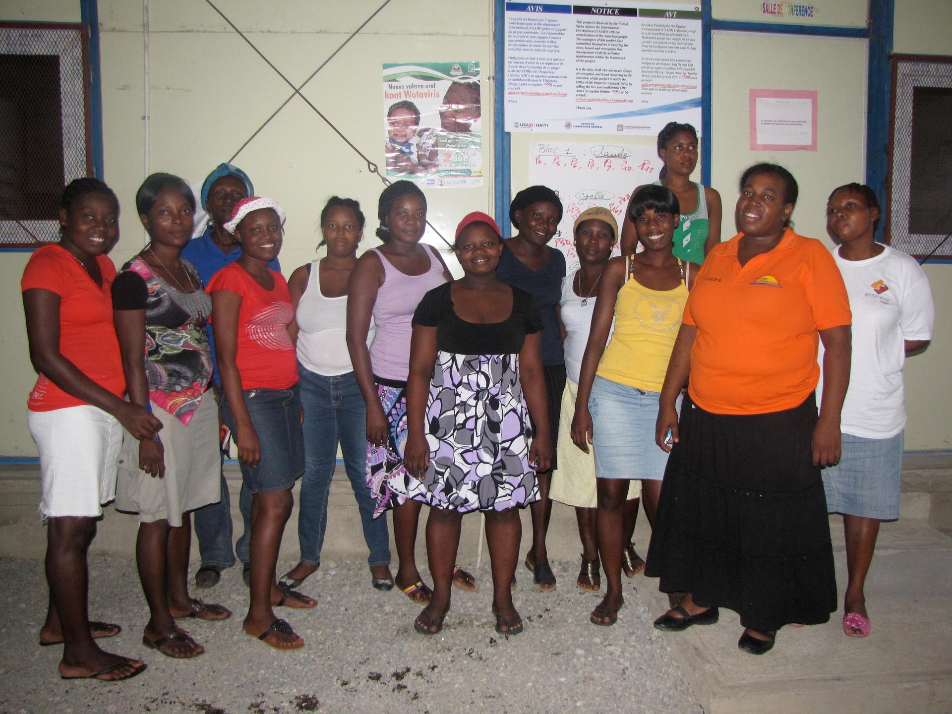 Members of the Association of Women of Potential of Village la Difference after their weekly meeting outside the Global Communities conference room.