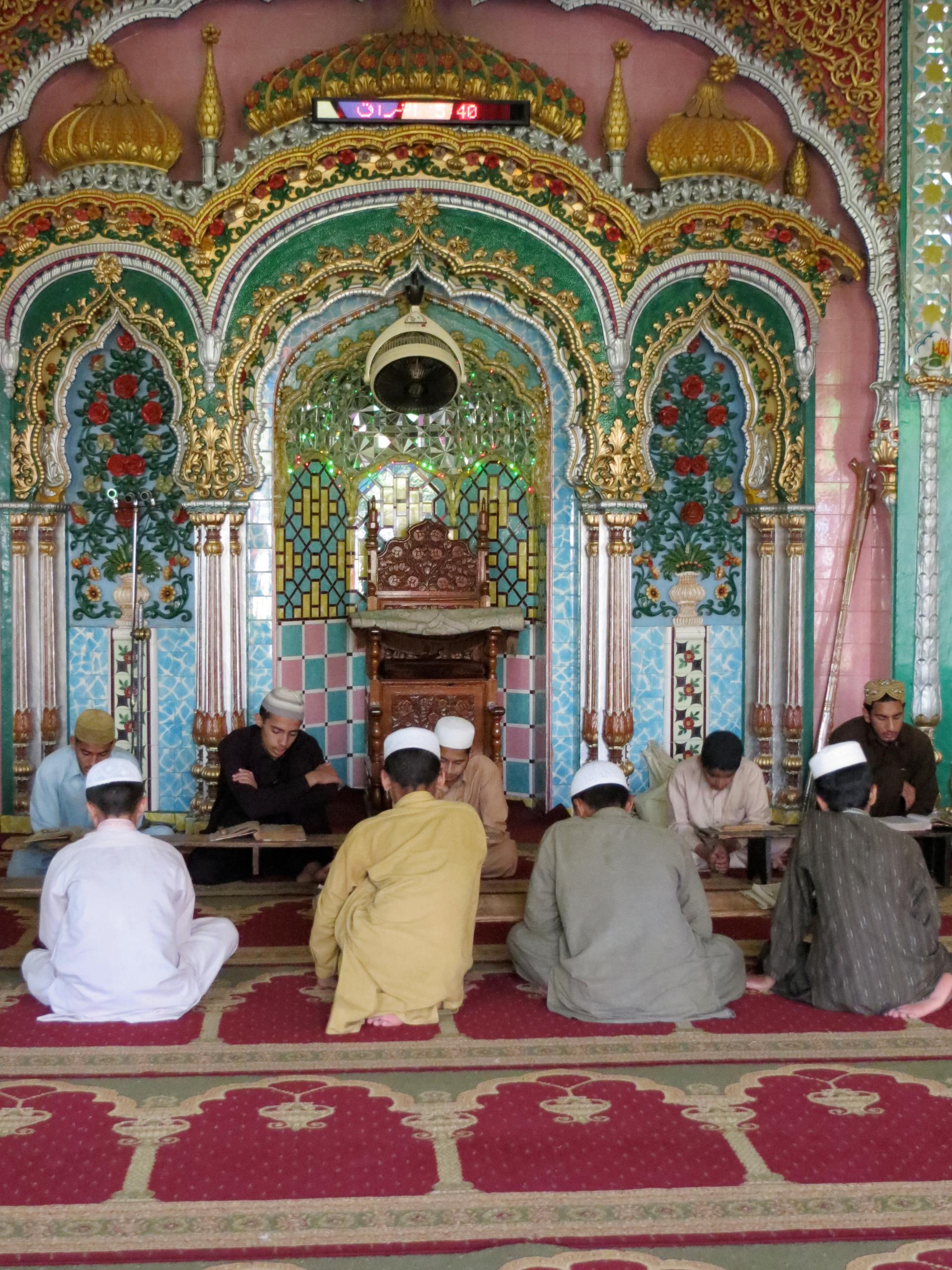 students praying at madrassa