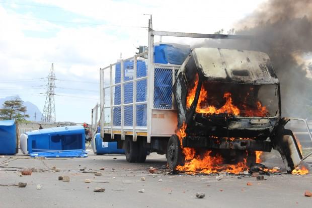 A burning truck blocks the road near Khayelitsha township.