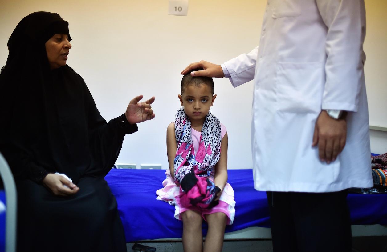 Seven-year-old Farah Abdallah, a Yemeni refugee, sits in a hospital in Djibouti on May 5, 2015.
