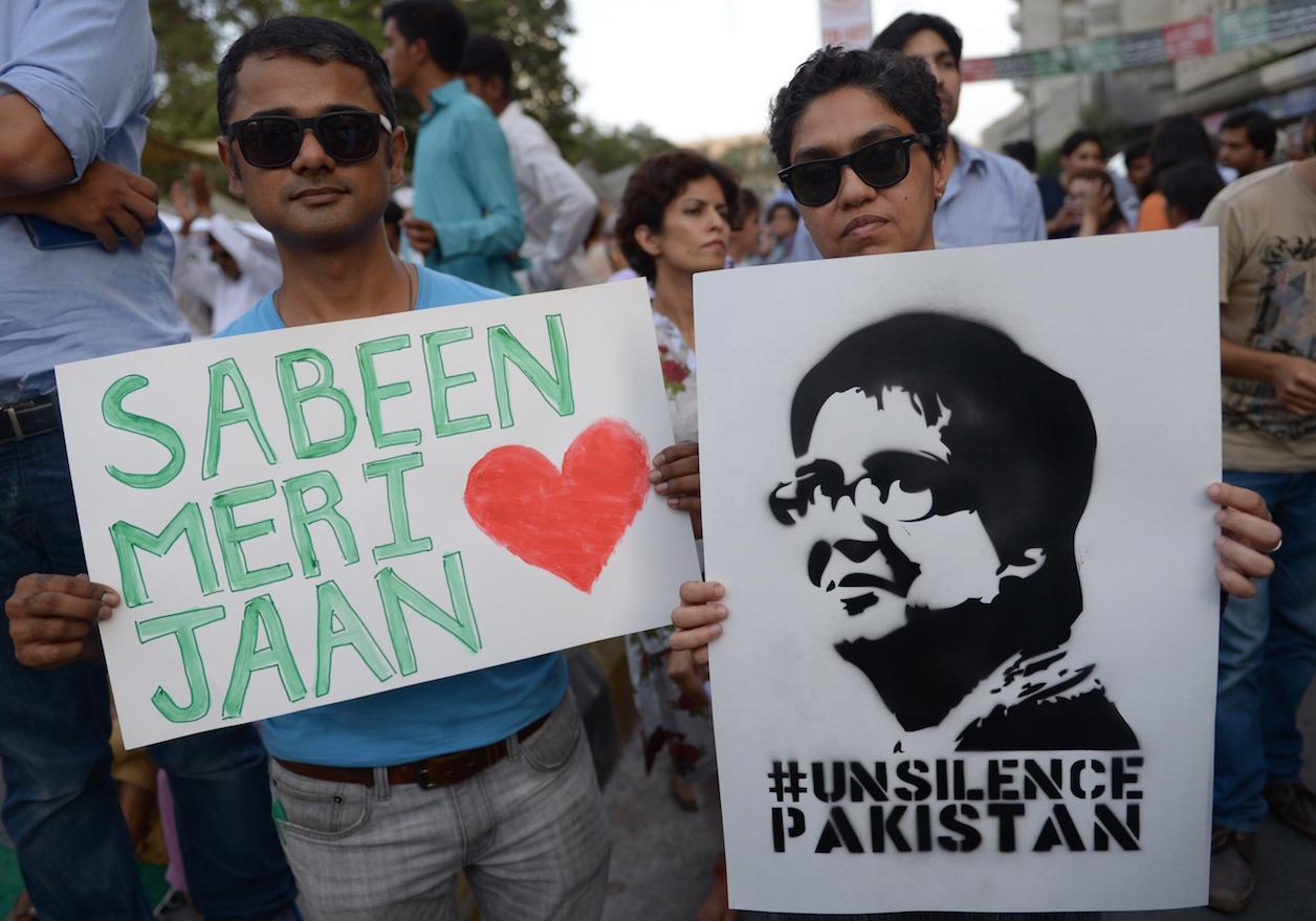 Pakistani civil society activists hold images of assassinated rights campaigner Sabeen Mahmud during a protest in Karachi.