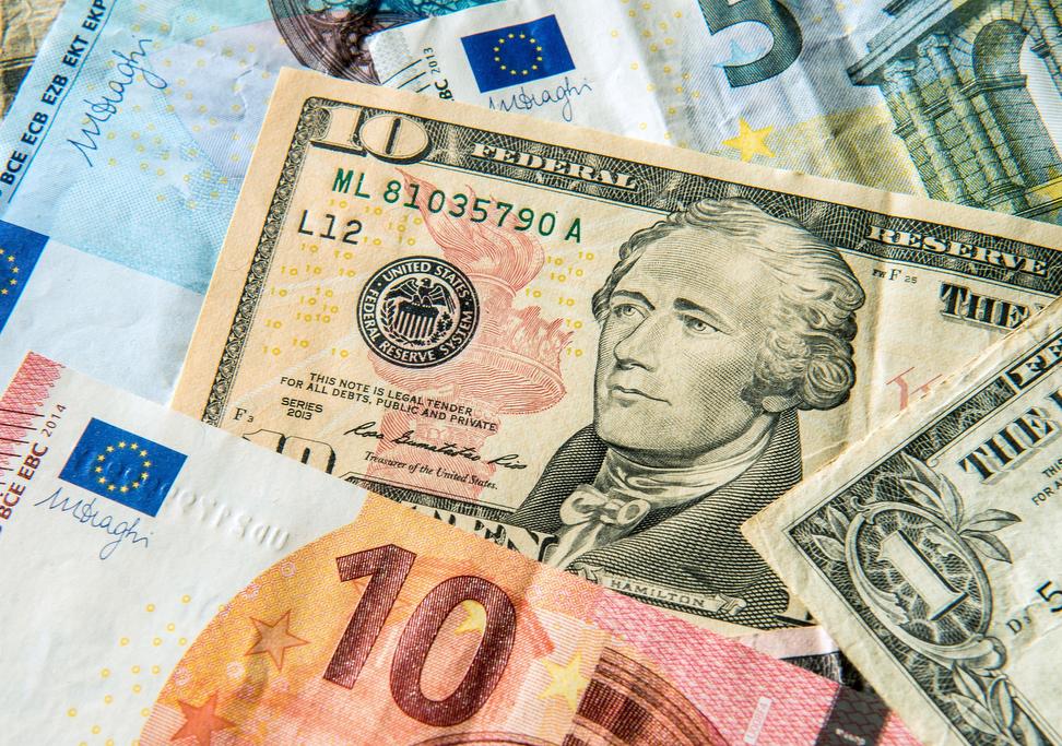 US banknotes seen among euro paper currency.