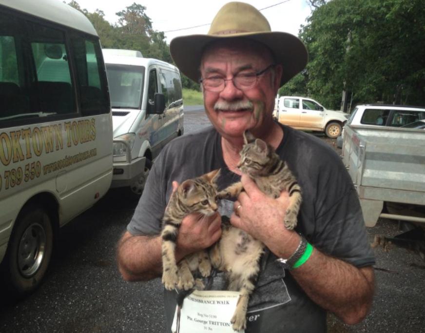 A photo from Warren Entsch's Facebook page shows the Australian conservative politician holding two cats.