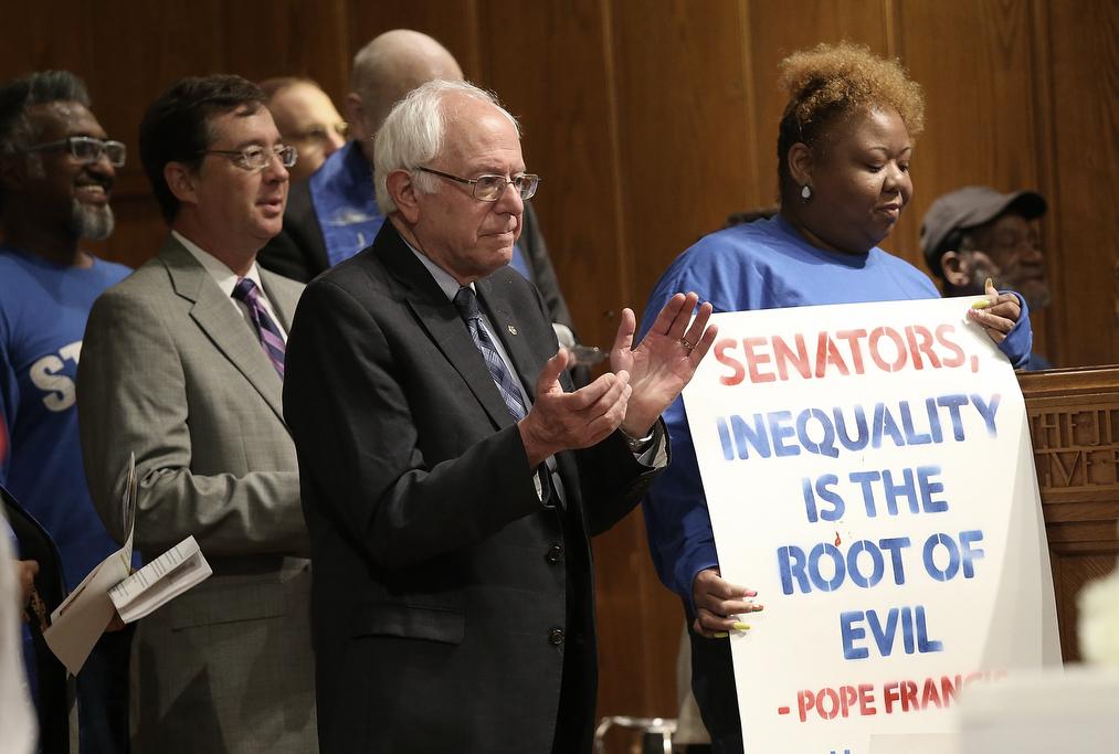 Democratic presidential candidate Bernie Sanders attends a meeting held by striking Capitol workers on Capitol Hill on Sept. 22, 2015.