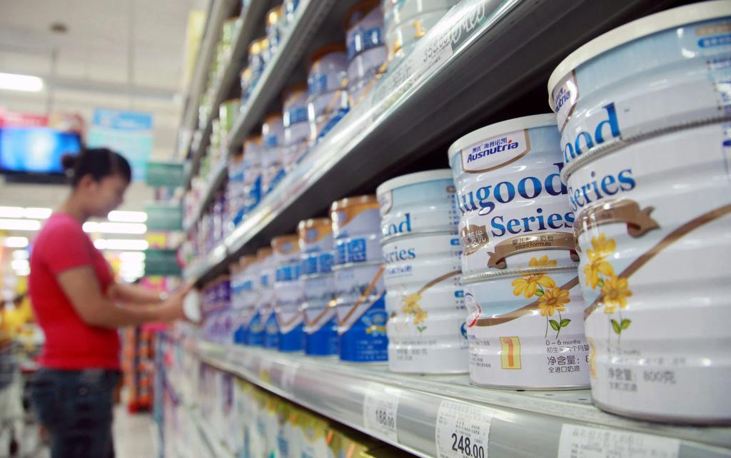 A woman looks at baby formula brands in a supermarket in the southern Chinese province of Hainan on Aug. 7, 2013. 