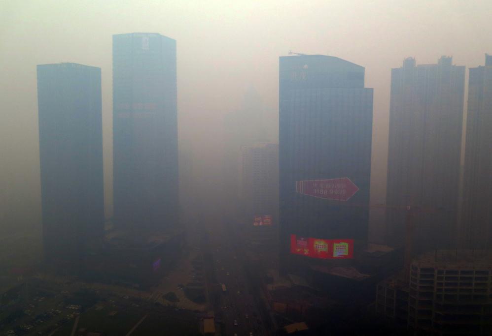 Residential buildings in Shenyang, in northeastern China, are shrouded in smog on Nov. 8, 2015.