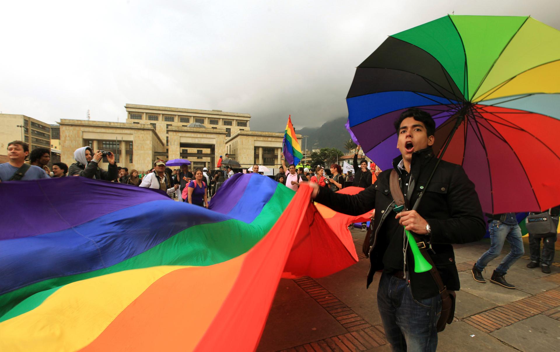 People shout slogans during a demonstration to support same-sex marriage in Bogota's Bolivar Square on April 23, 2013.