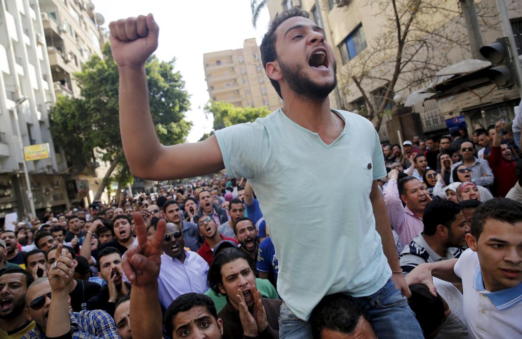 Egyptian protesters shout slogans against President Abdel Fattah al-Sisi and the government during a demonstration protesting the government's decision to transfer two Red Sea islands to Saudi Arabia, in front of the Press Syndicate in Cairo, Egypt, April