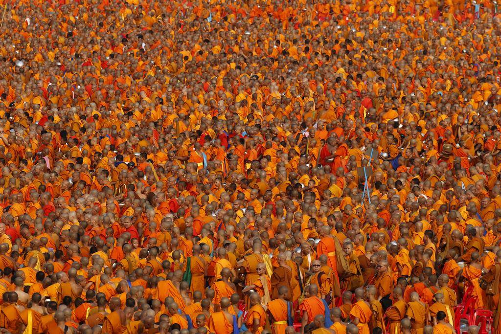 Over 100,000 Buddhist monks and novices gather to receive alms at Wat Phra Dhammakaya temple in Pathum Thani, outside Bangkok, on April 22, 2016.