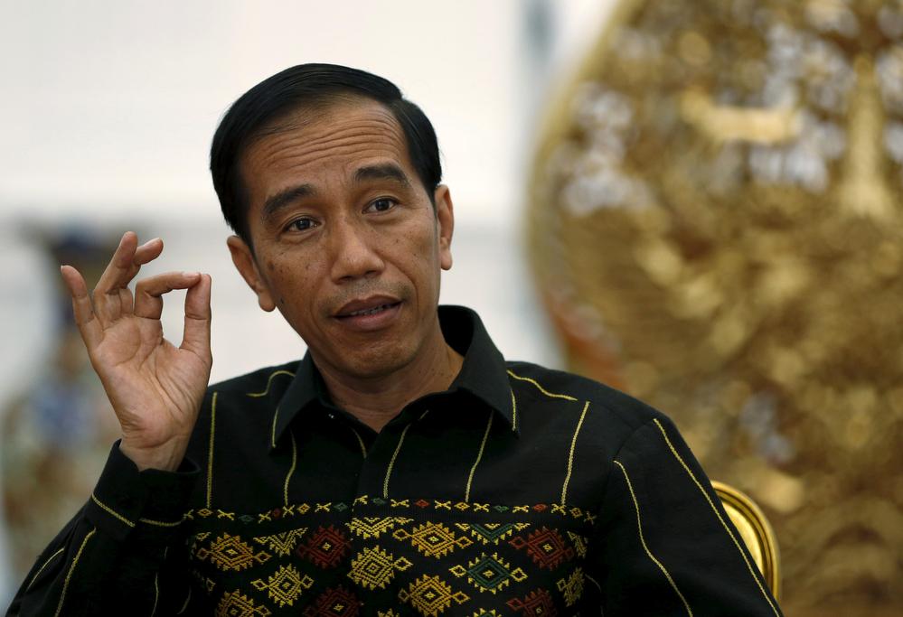 Indonesian President Joko Widodo gestures during an interview with Reuters at the Presidential Palace in Jakarta, Indonesia, February 10, 2016.