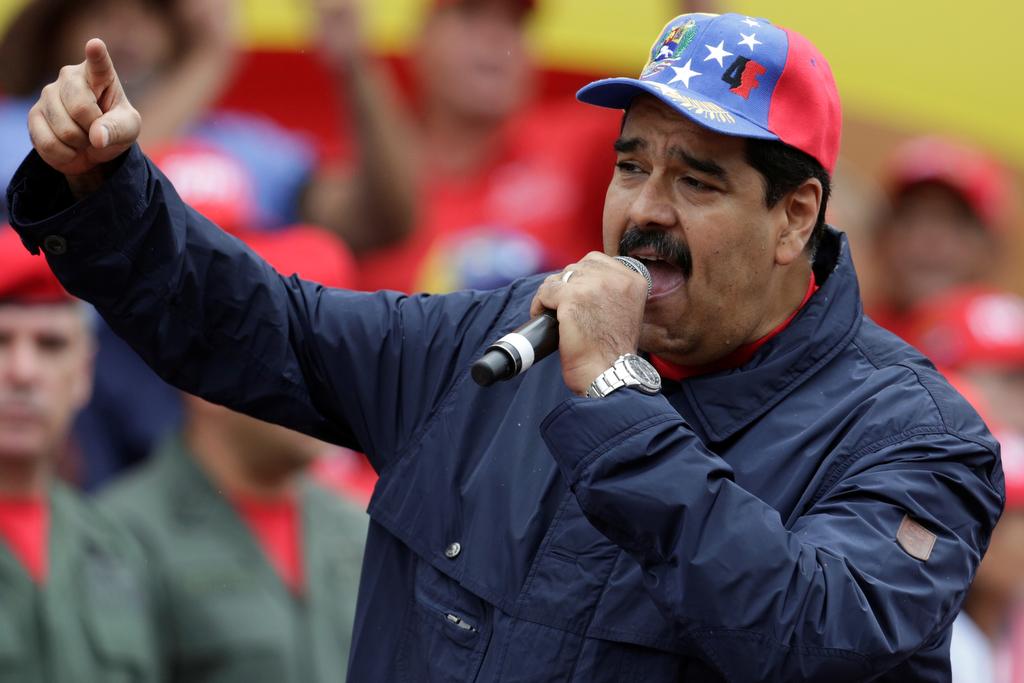 Venezuelan President Nicolas Maduro gestures as he talks to supporters during a rally to commemorate May Day in Caracas, Venezuela, on May 1, 2016.