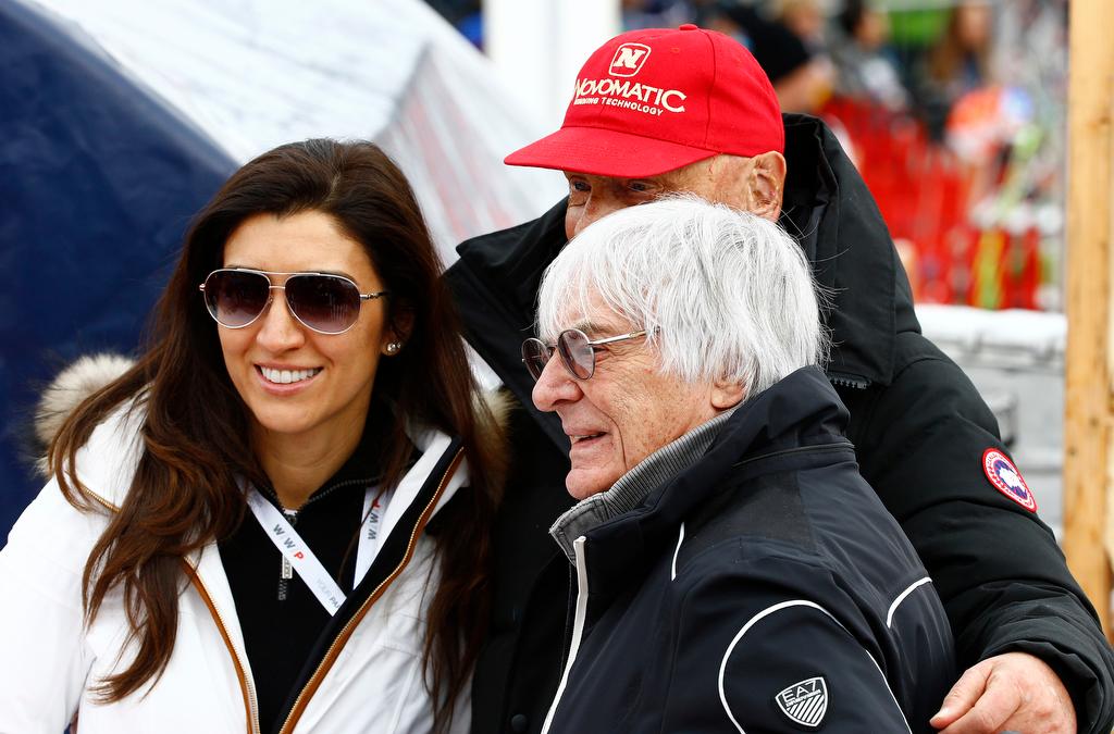 Formula One Chief Executive Bernie Ecclestone (R), his wife Fabiana Flosi and Former Formula One champion Niki Lauda pose for a picture during the men's Alpine Skiing World Cup downhill race in Kitzbuehel, Austria, January 23, 2016. 