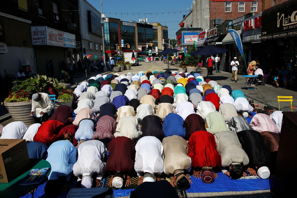 Muslim men attend Eid al-Fitr prayers to mark the end of the holy fasting month of Ramadan in the Queens borough of New York, U.S., July 6, 2016.