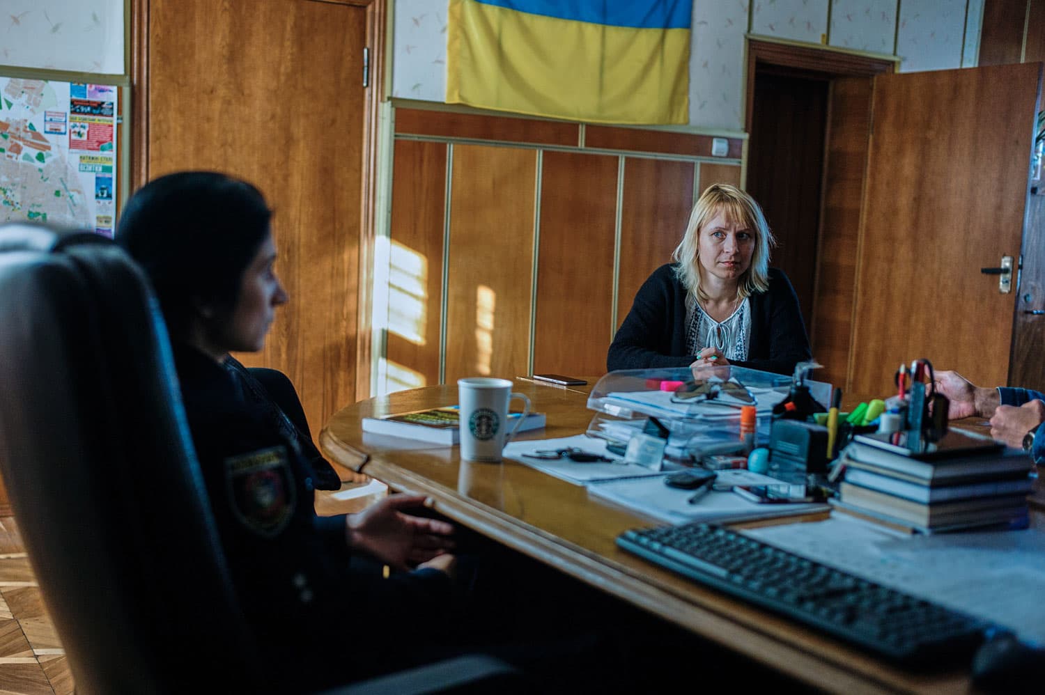 Sveta Moroz from NGO Svitanok Club explains the situation with drug users in Borispol to Chief of Police Lt. Maya Breslavski.