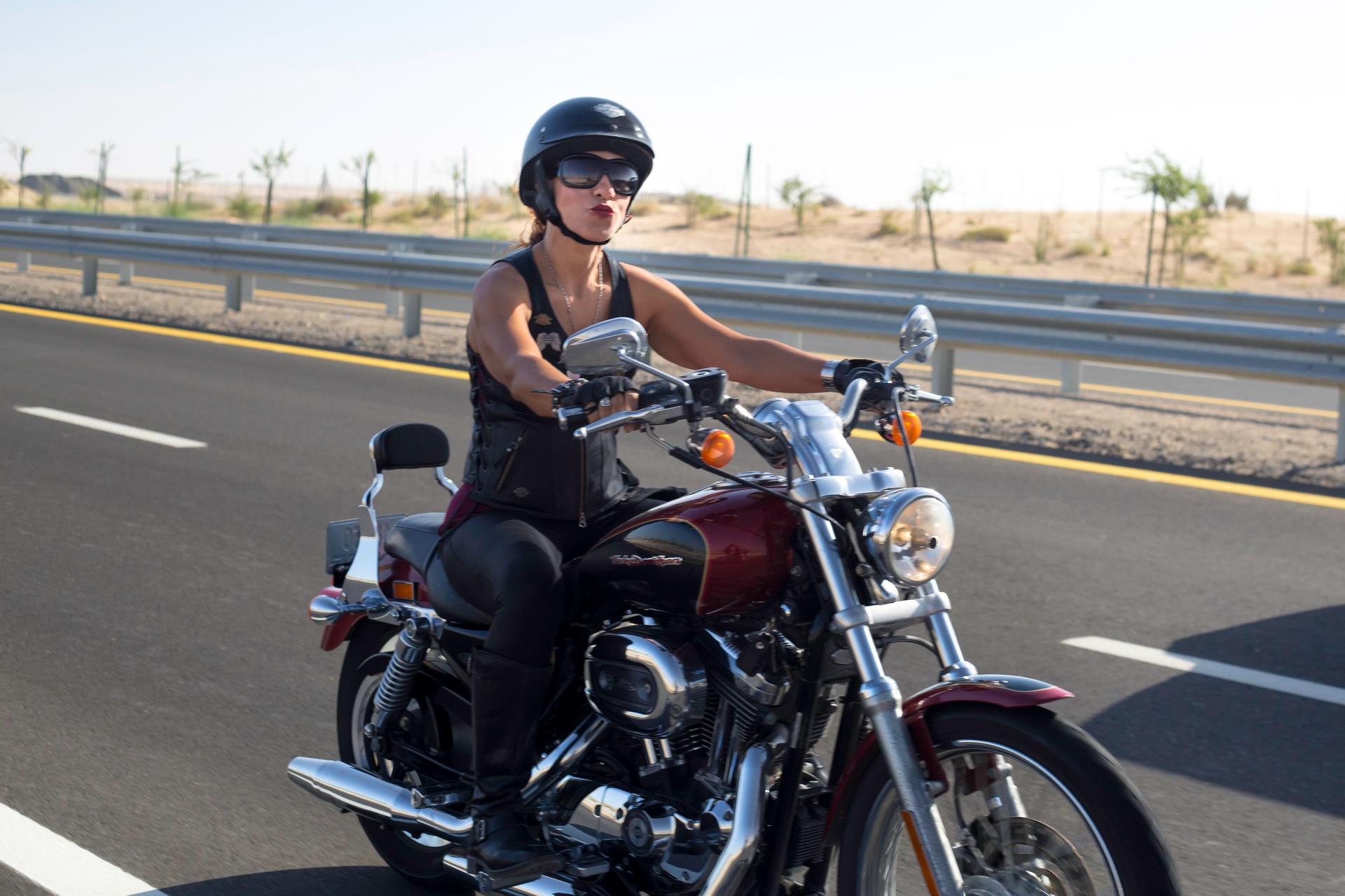 A Dubai Ladies of Harley rider on the road during International Female Ride Day.