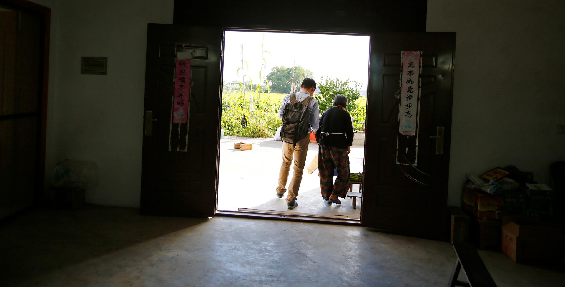 Wang Yufang and her grandson, Gu Hangyu, at her home on Chongming Island, near Shanghai. Gu says when he has a family, he'd like his son or daughter to speak his native Chongming dialect. Many young Chinese do not speak their grandparents' dialects.