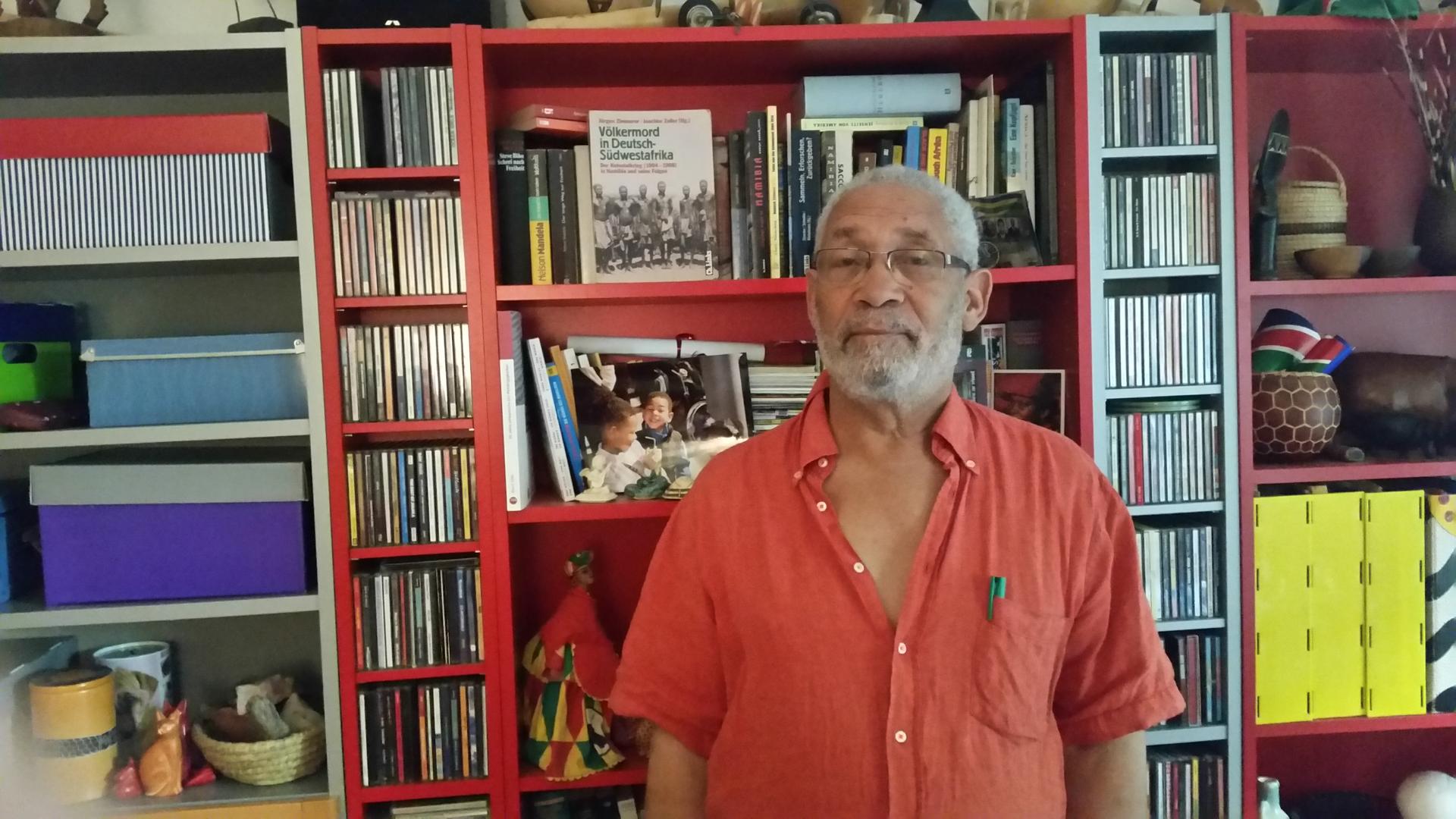 Namibian activist Israel Kaunatjike in his home in Berlin