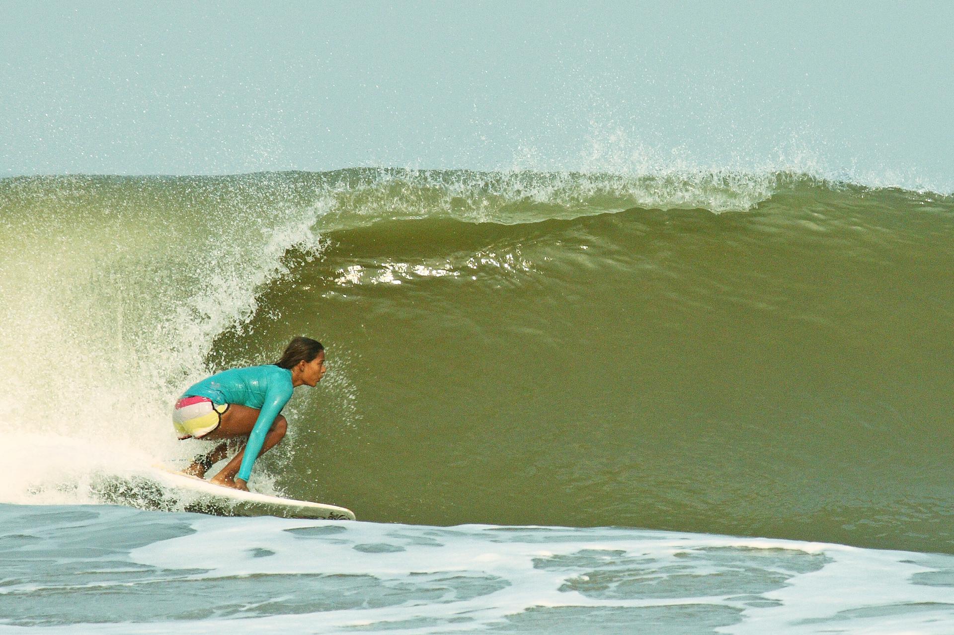 Ishita Malaviya catches a wave along the west coast of India.