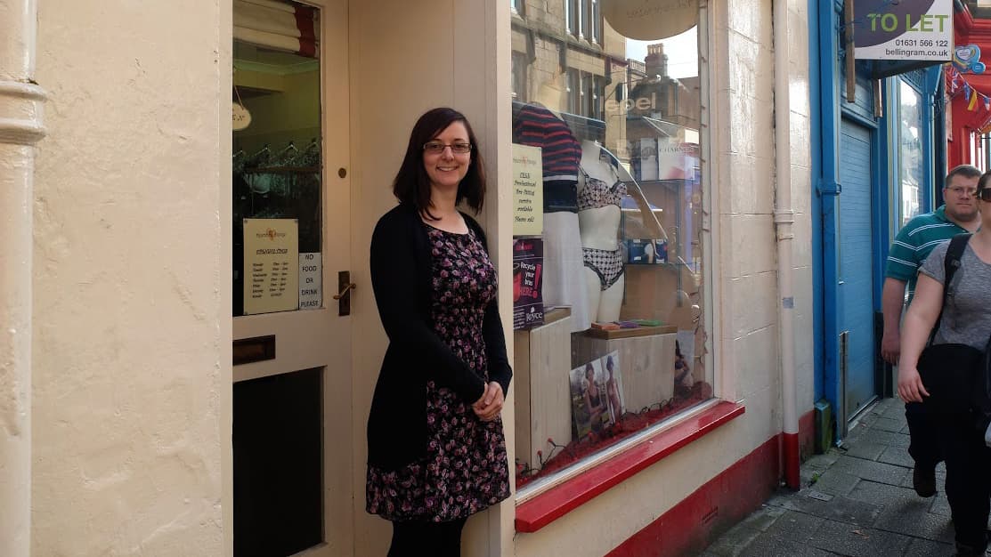 Deirdre Sharkey stands outside of her lingerie shop, Precious Things, in Oban. Sharkey moved to Oban after marrying her Scottish husband — he's also a business owner — and they'll both vote