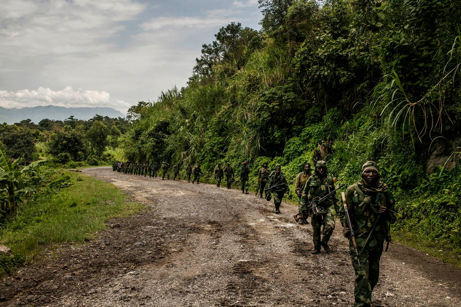 Congolese soldiers advance up the mountainous road toward Bunagana, the last remaining stronghold of the M-23 rebels on Wednesday.