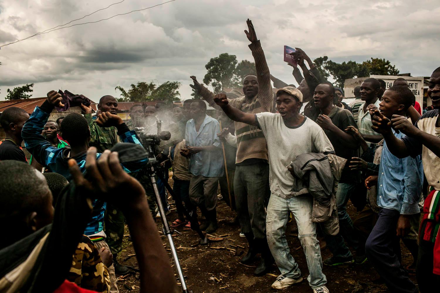 With heavy guns still smoking, residents of the town of Bunagana, celebrate the routing of M-23 rebels by the Congolese army.