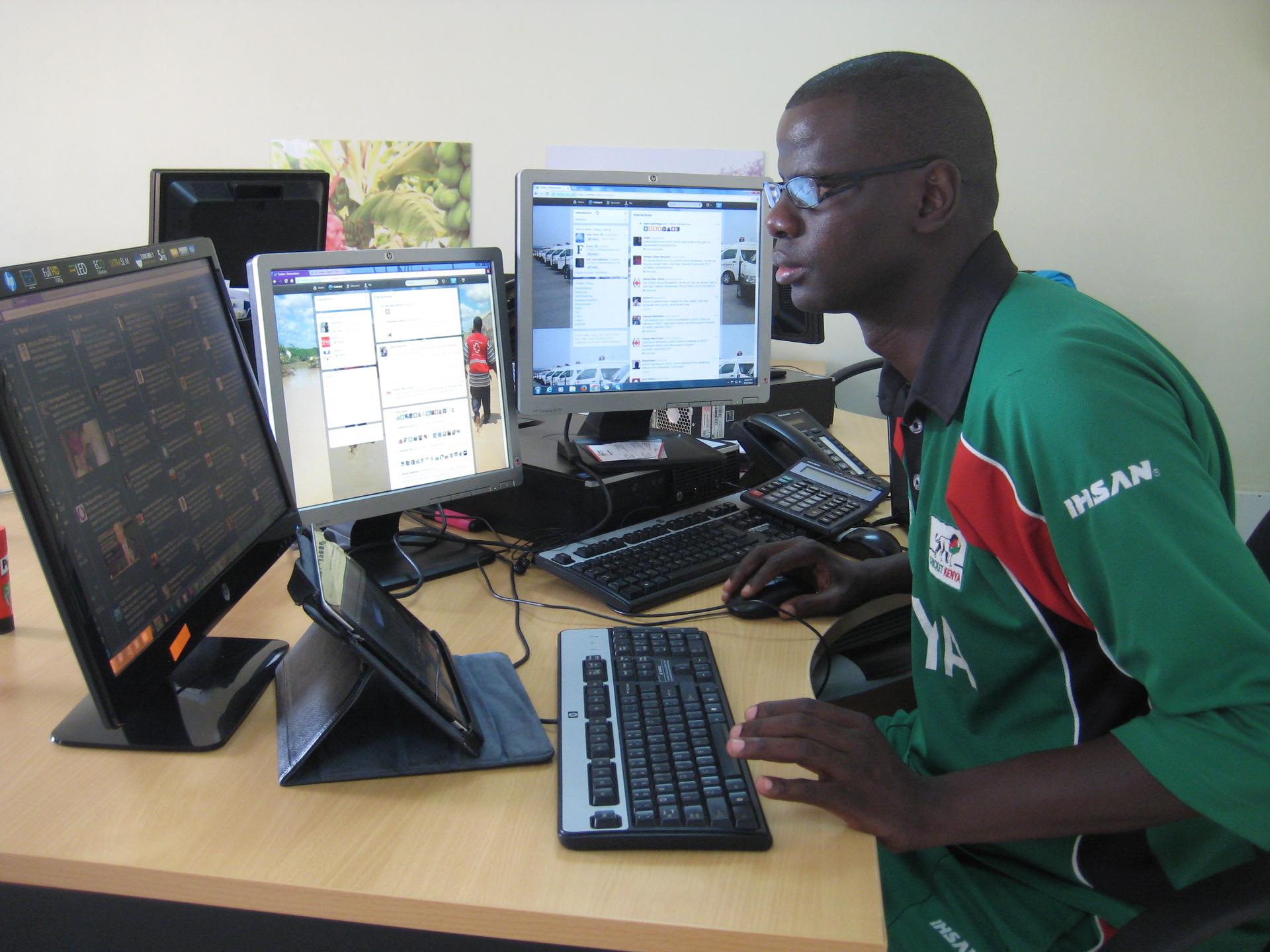 Philip Ogola runs Kenya Red Cross's social media command center from his desk in Nairobi.