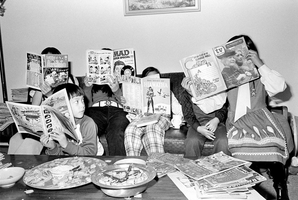 Michael Jang's cousins reading Mad magazine and comics.