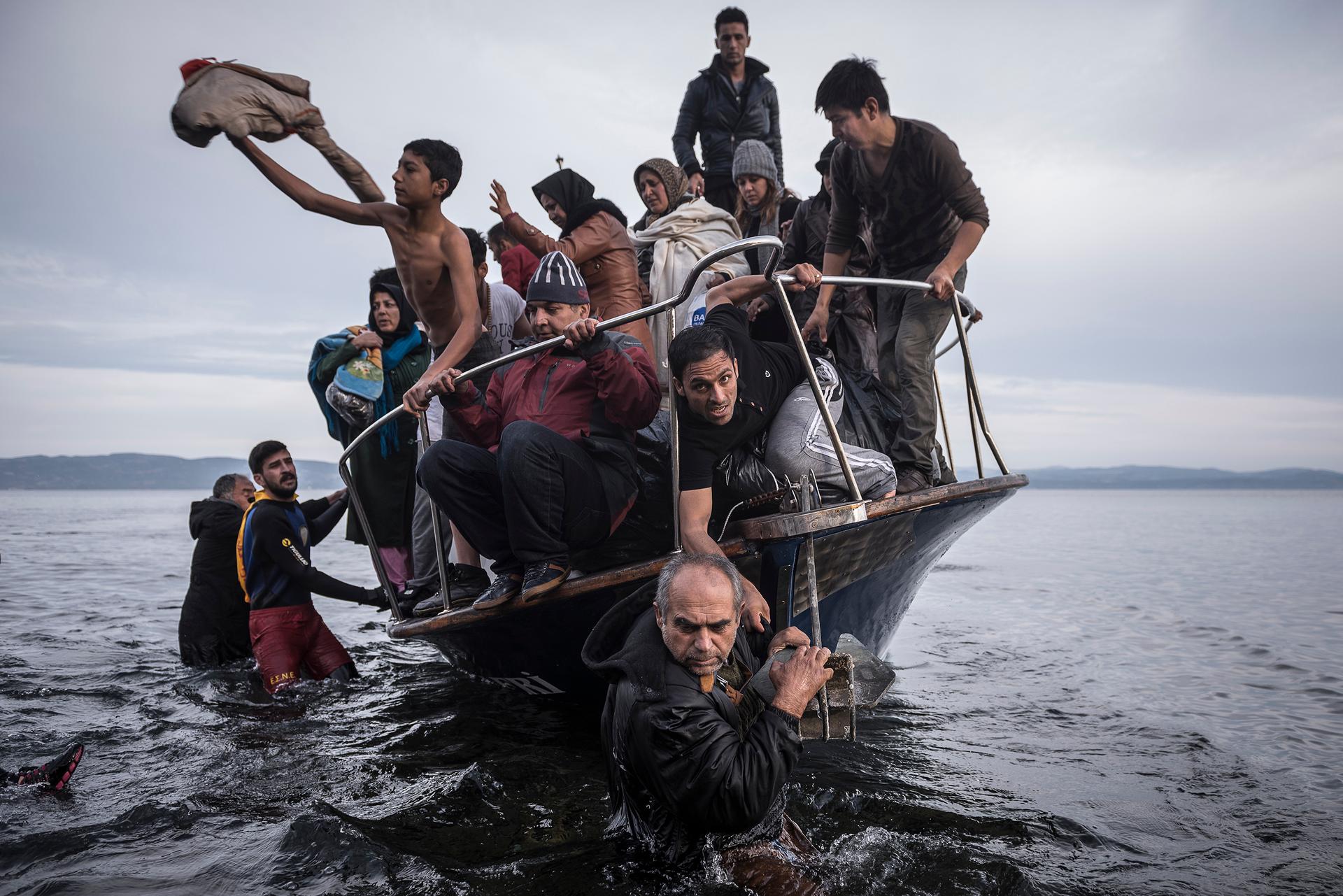 Refugees arrive by boat near the village of Skala on Lesbos, Greece, 16 November 2015.