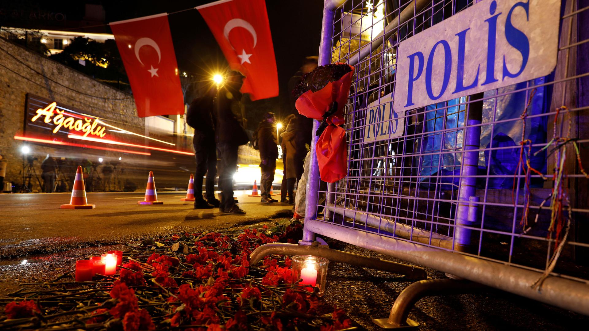 Police have erected barricades and mourners have left flowers outside Reina, the nightclub in Istabul where 39 died during a terrorist attack. 
