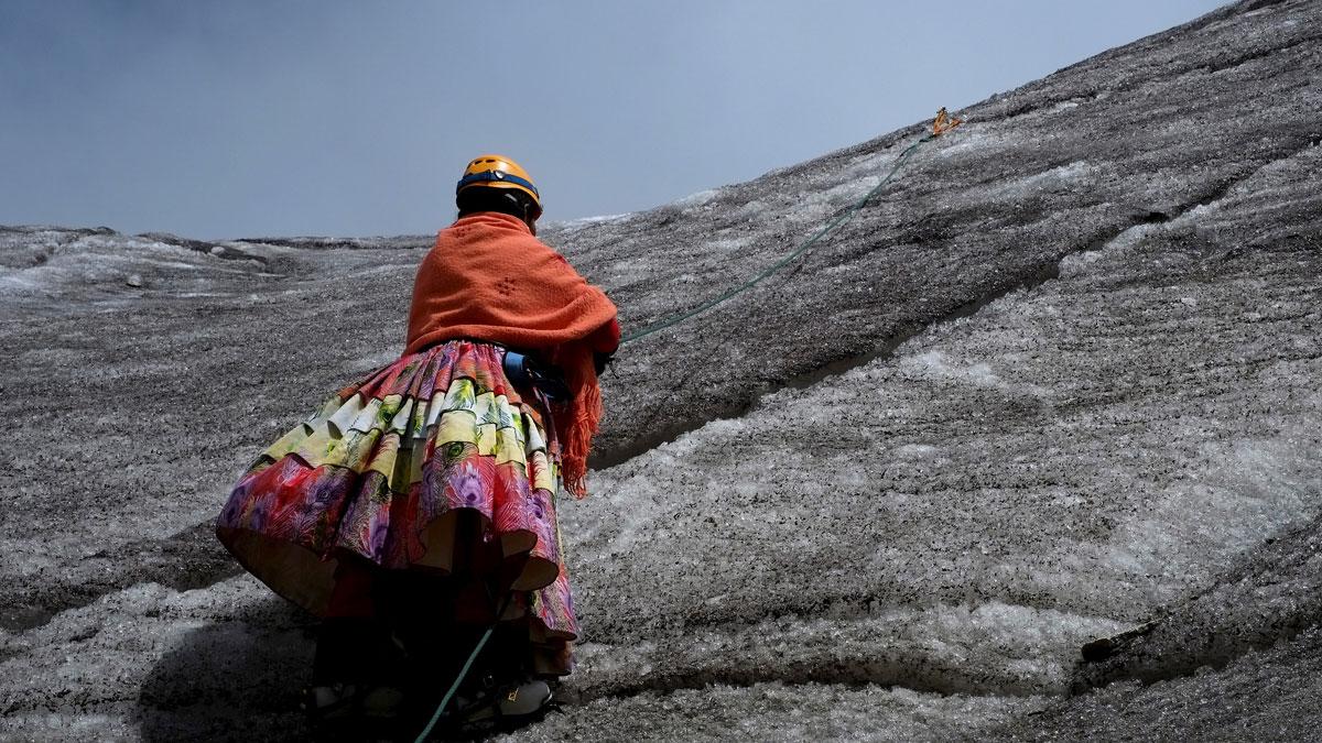 An Aymara indigenous woman practices climbing on the Huayna Potosi mountain, Bolivia April 2016.