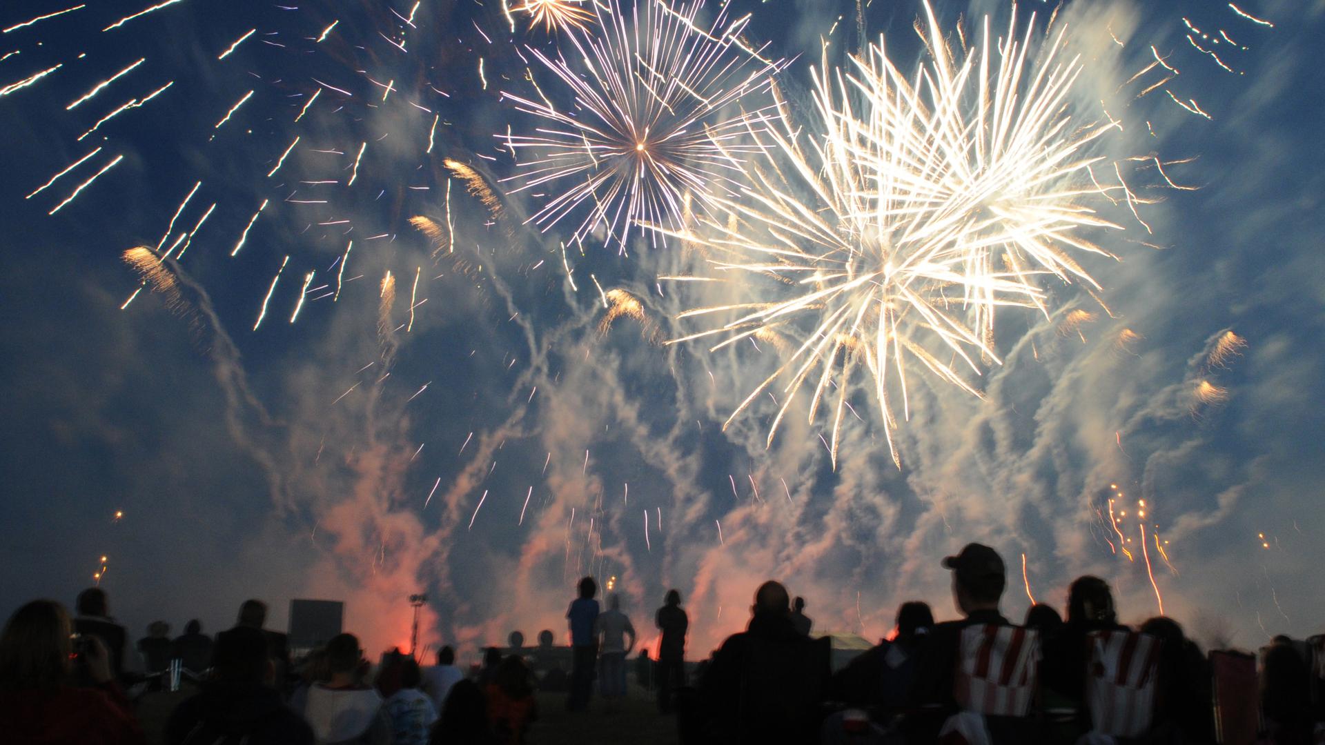 Fireworks light up the evening sky above RAF Feltwell during the annual 4th of July celebration. The festivities included games, rides, contests and food booths.