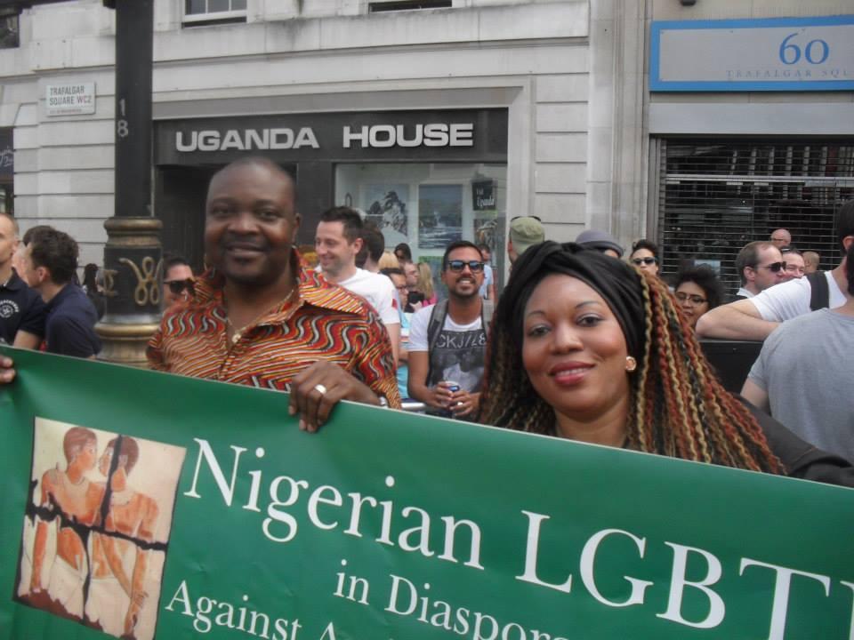 Nigerian gay rights activist Davis Mac-Iyalla (left) holding a banner at London's 2013 Pride Parade protesting anti gay rights laws. On January 7th, Nigerian President Goodluck Jonathan signed the Same Sex Marriage Prohibition Act, which criminalizes gay 