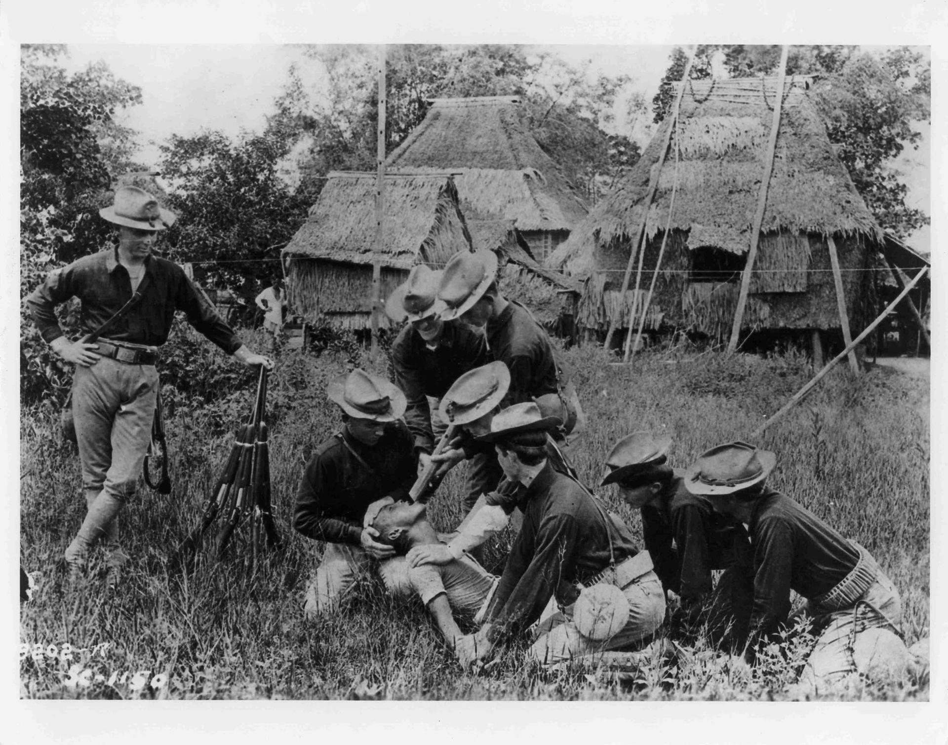 Soldiers from the 35th US Volunteer Infantry subject a Filipino to the ‘water cure,’ a common ‘enhanced interrogation’ technique employed during the war to pacify the Philippines between 1899 and 1902. 