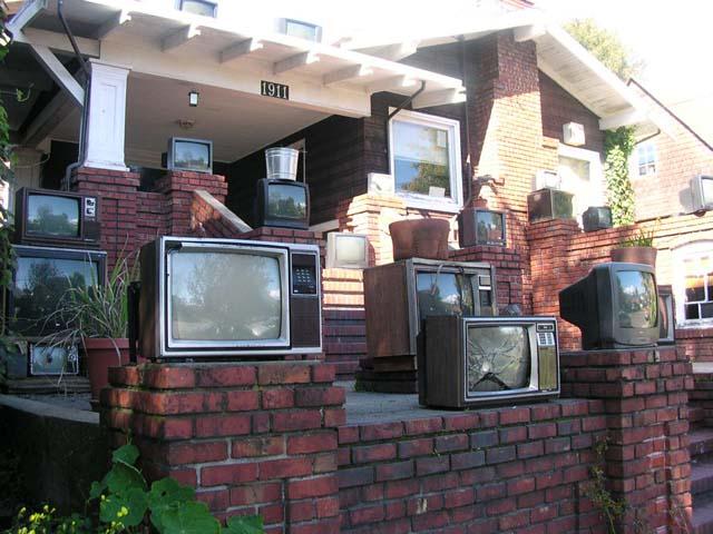 A house in Berkeley, Calif. decorated with old TV sets.
