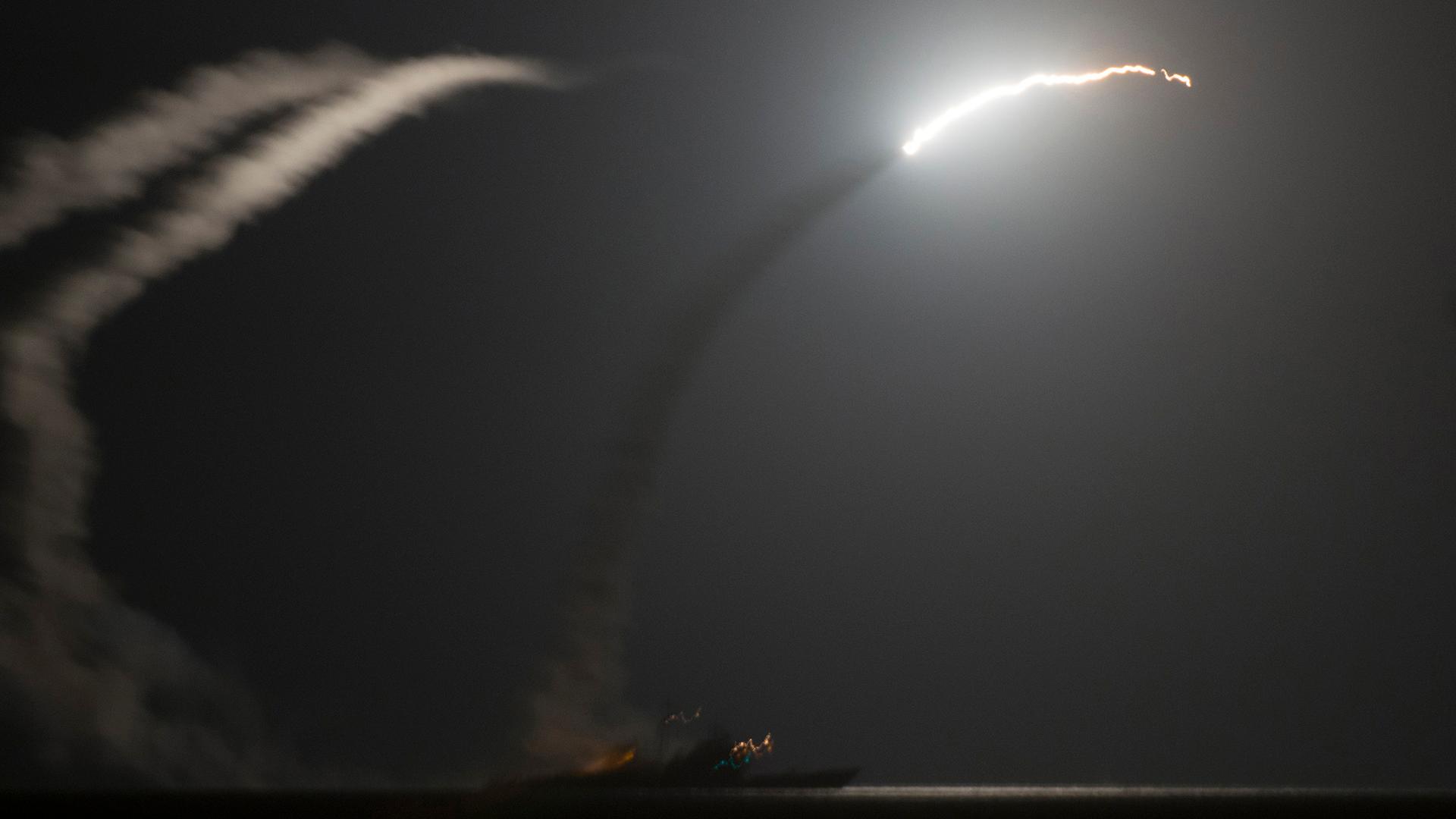 The guided-missile cruiser USS Philippine Sea (CG 58) launches a Tomahawk cruise missile against ISIS targets in Syria on September 23, 2014.