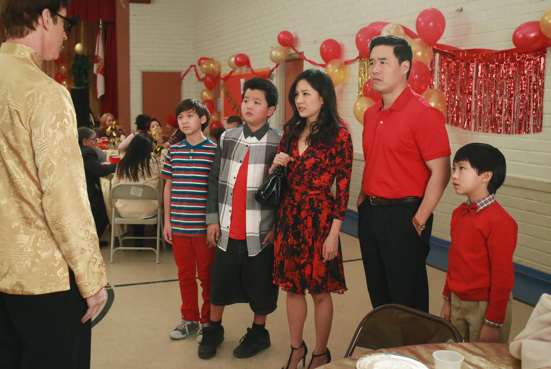 Four members of the Huang family at a Chinese New Year celebration in the show "Fresh Off the Boat"