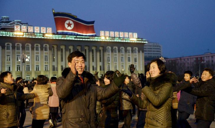 North Koreans dance to celebrate what the country claims was a "successful hydrogen bomb" test at Kim Il Sung square in Pyongyang, North Korea. January 8, 2016.