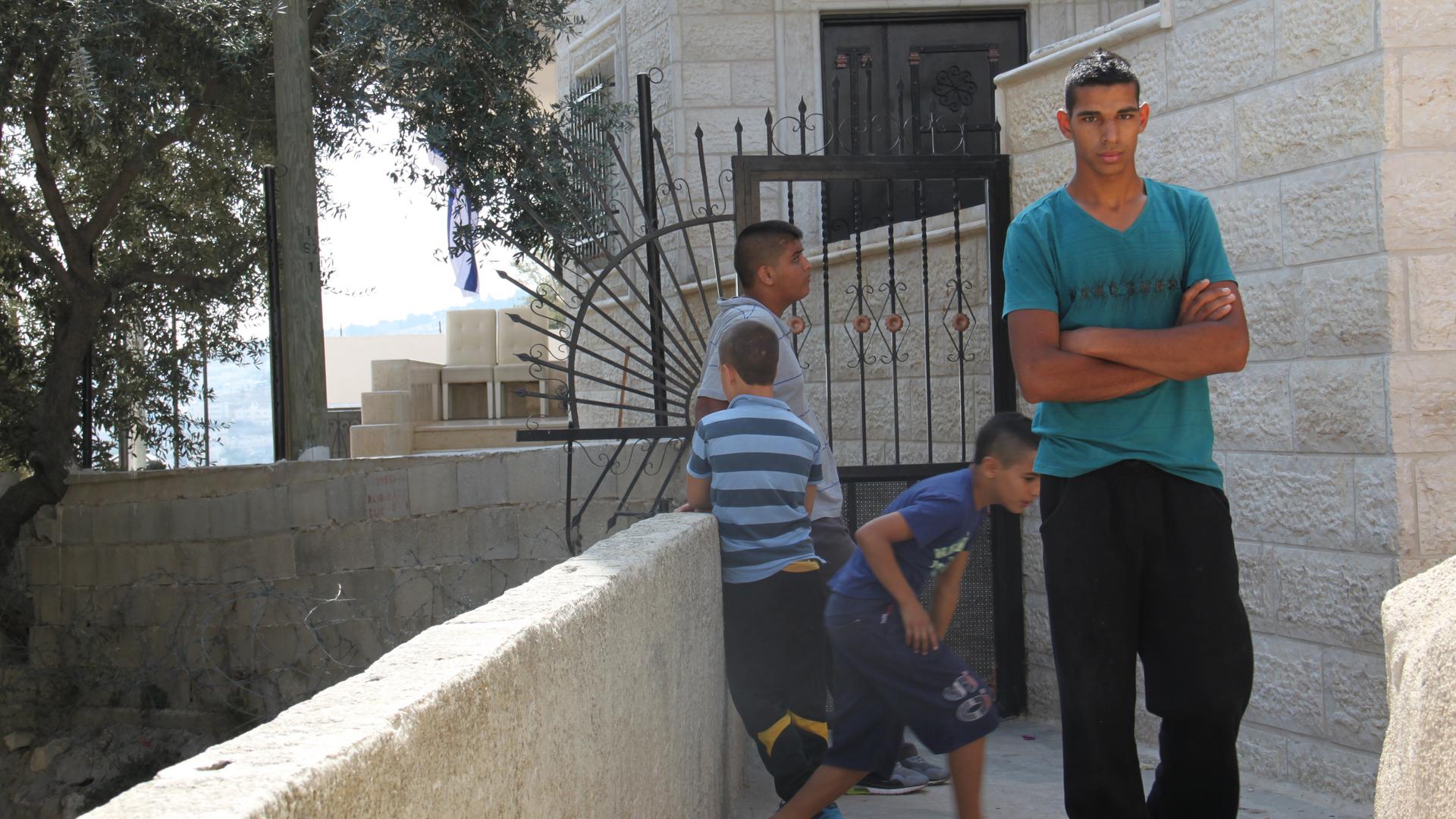 Palestinian residents in front of the Baydoun home recently occupied by Israelis.