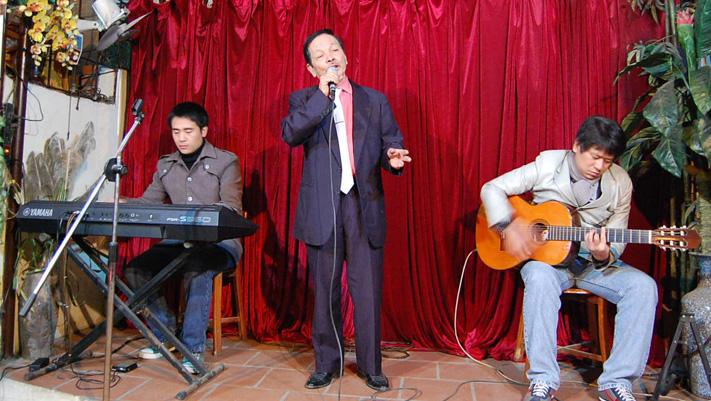 Nguyễn Văn Lộc takes the stage several nights a week at his cafe, performing many of Vietnam’s most popular love songs, in a style called "nhạc trữ tình," which means "romantic music."