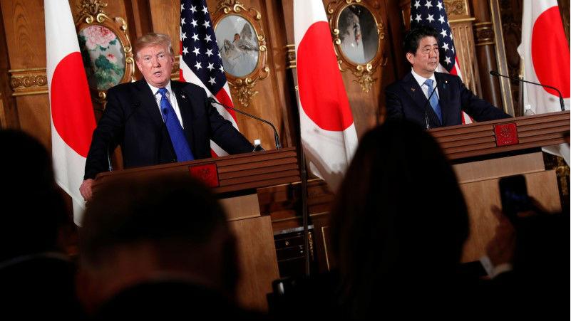 U.S. President Donald Trump and Japan's Prime Minister Shinzo Abe stand at podiums and hold a news conference at Akasaka Palace in Tokyo, Japan on November 6, 2017.