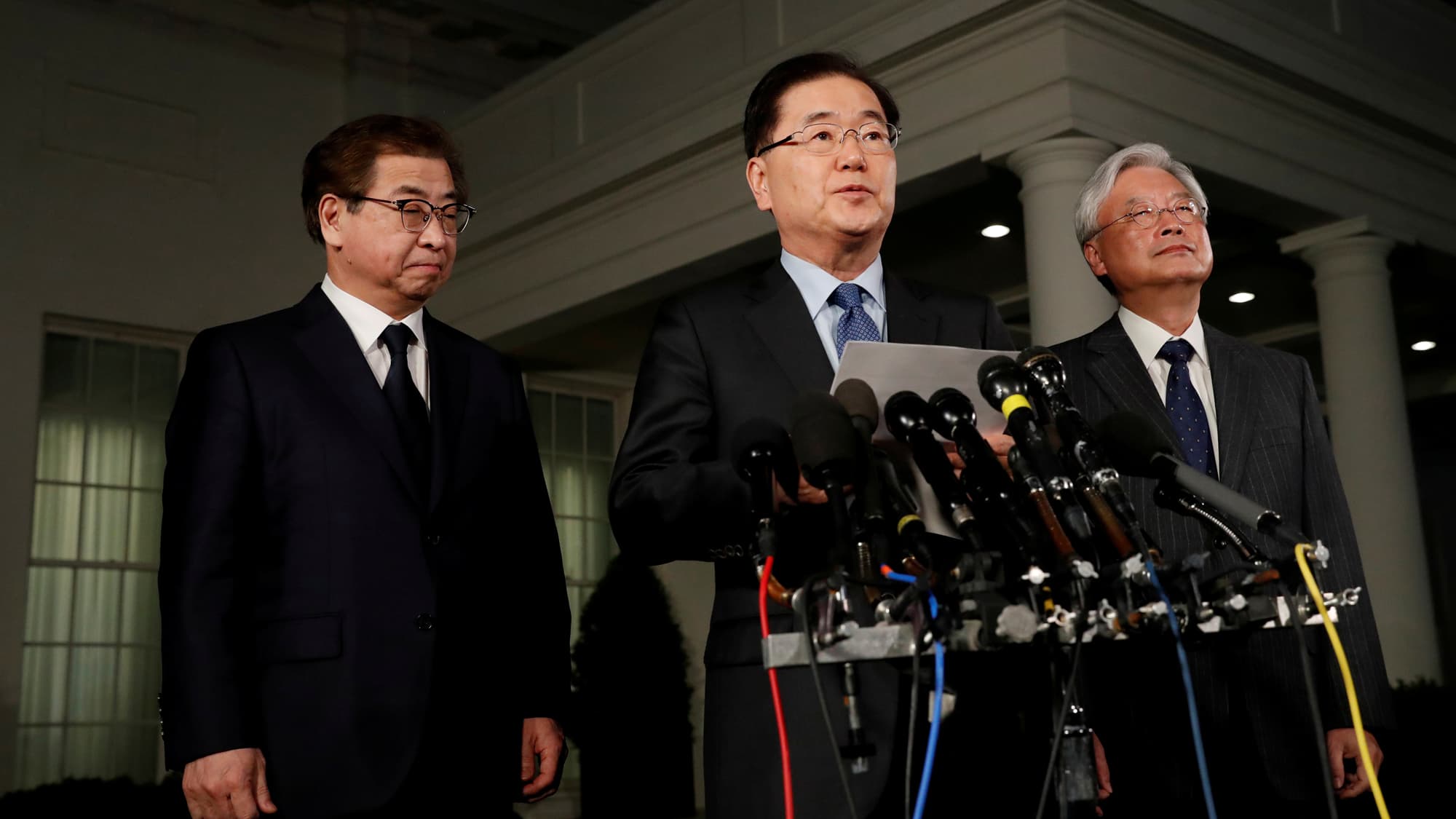 South Korea's National Security Office head Chung Eui-yong stands at a podium making an announcement.