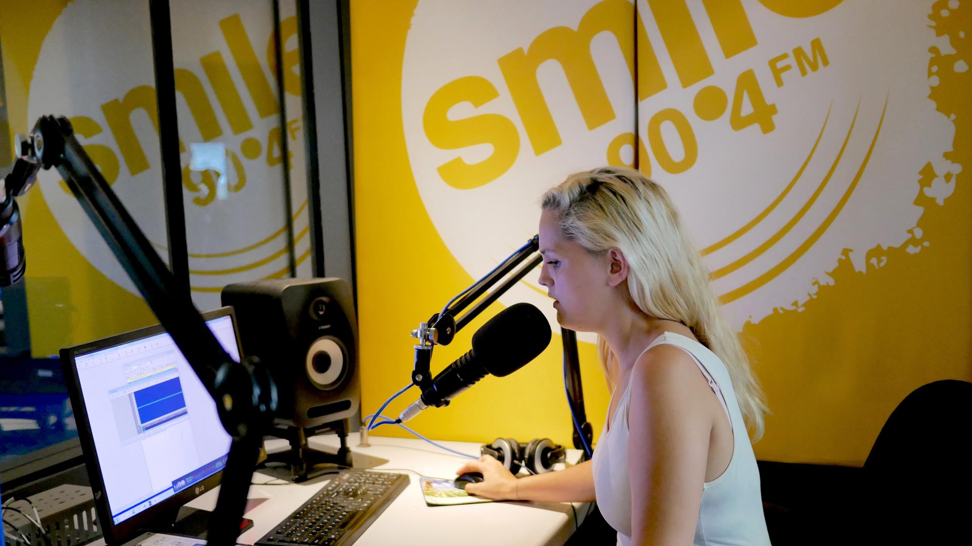 Saya Pierce-Jones records a recent report on Cape Town's water crisis for Smile 90.4FM radio. In more than a year on the full-time water beat, Pierce-Jones helped listeners understand the roots of the crisis and find ways to dramatically cut their water u