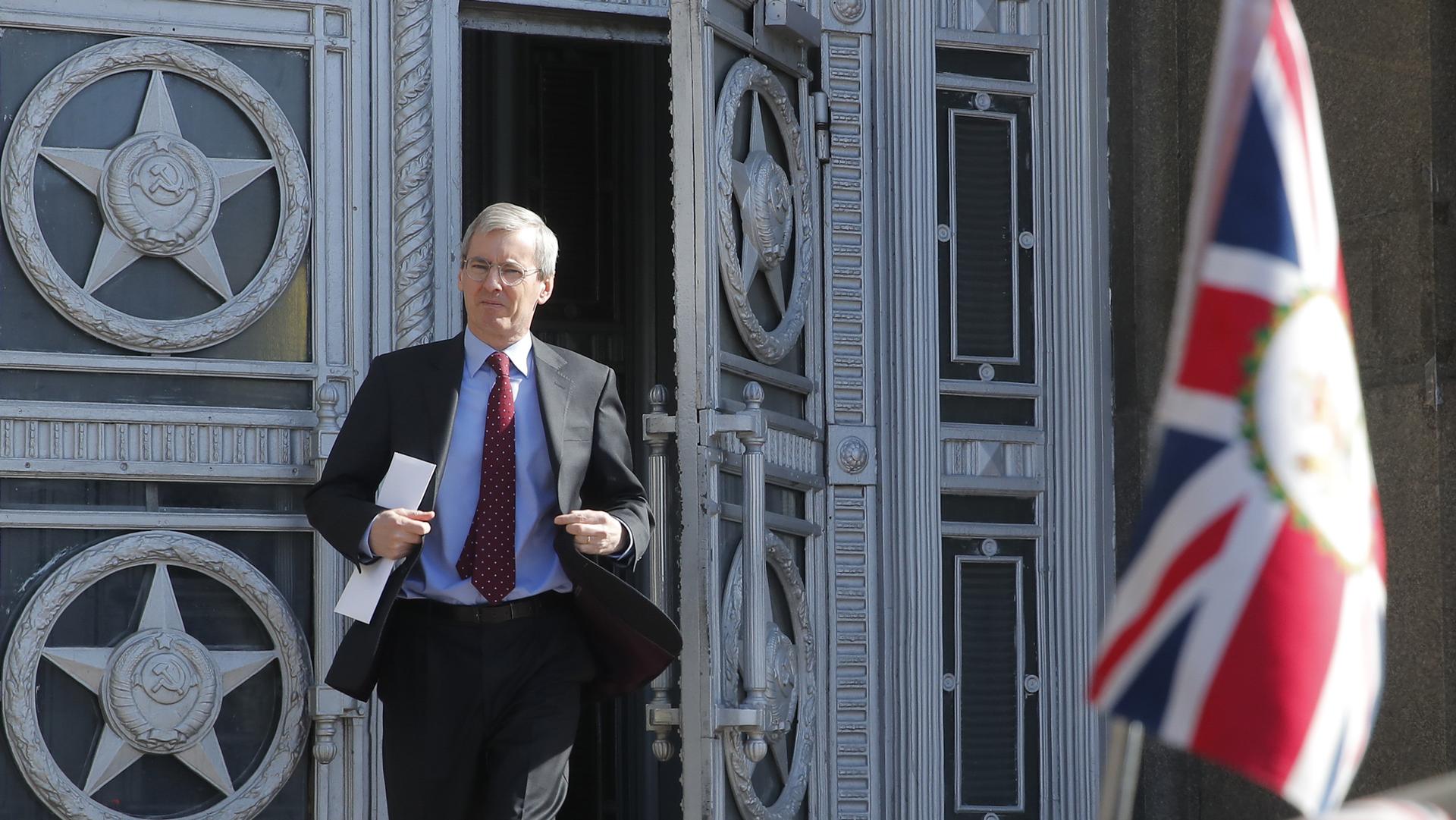 British Ambassador to Russia, Laurie Bristow, is seen walking out of the Russian foreign ministry building in Moscow.