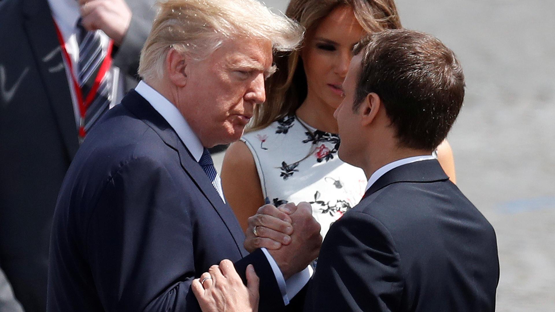 French President Emmanuel Macron shakes hands with US President Donald Trump in Paris, July 14, 2017.