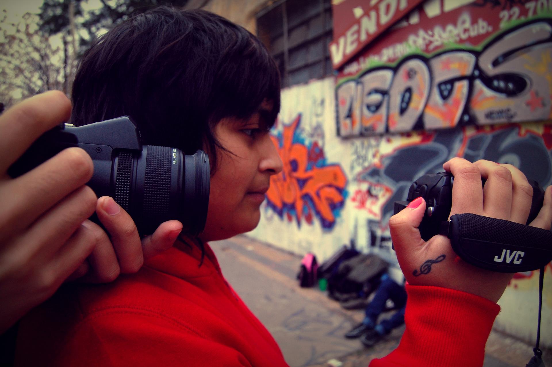 Teenagers film video in Argentina. A new study says that adolescents seem to have become more creative in visual arts.