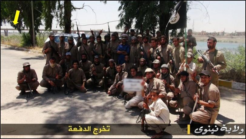 This photo purportedly shows an ISIS class of 2014 martial arts graduation photo, and in the background, a bridge spanning a large river.