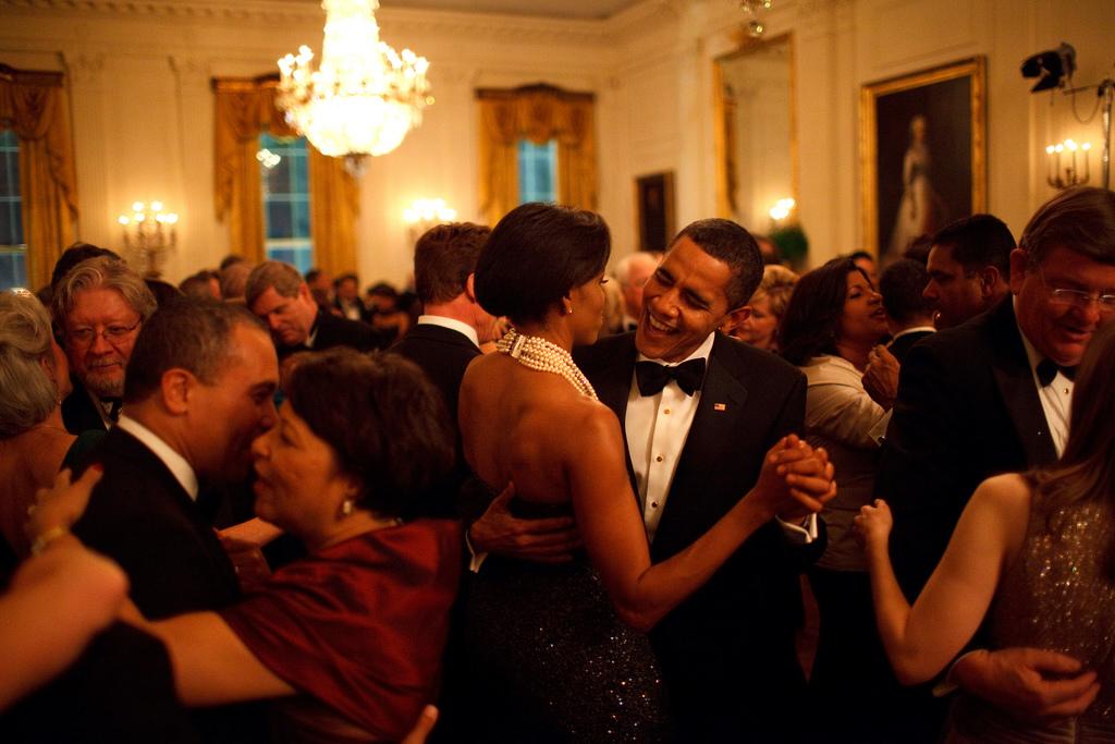Former President and First Lady Michelle Obama dance together at the Governors Ball in 2009. 